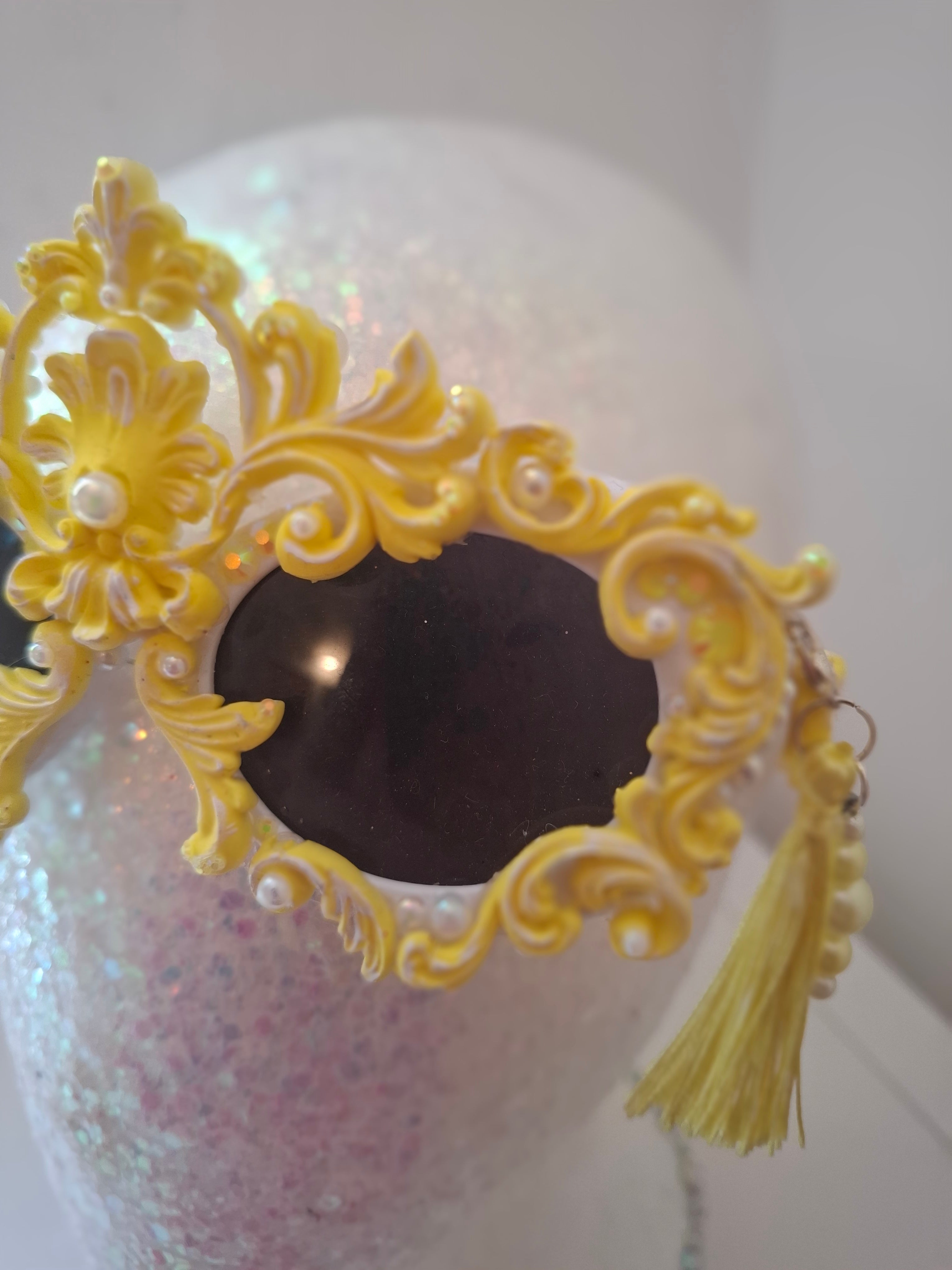 Hand-sculpted sunglasses in gold scrollwork with pearls and tassel drops. 