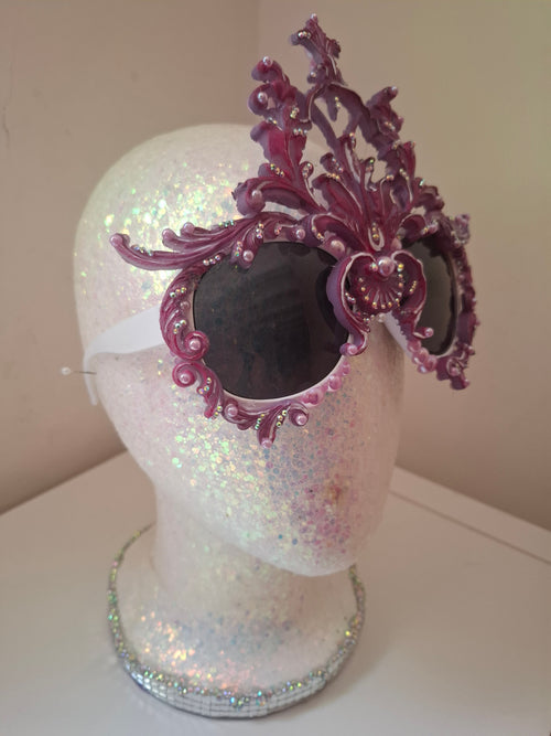 Hand-sculpted sunglasses in iridescent rose-to-lavender scrollwork with crystals. 