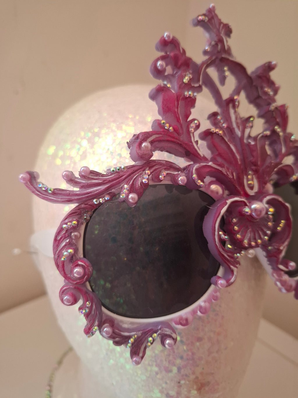 Hand-sculpted sunglasses in iridescent rose-to-lavender scrollwork with crystals. 