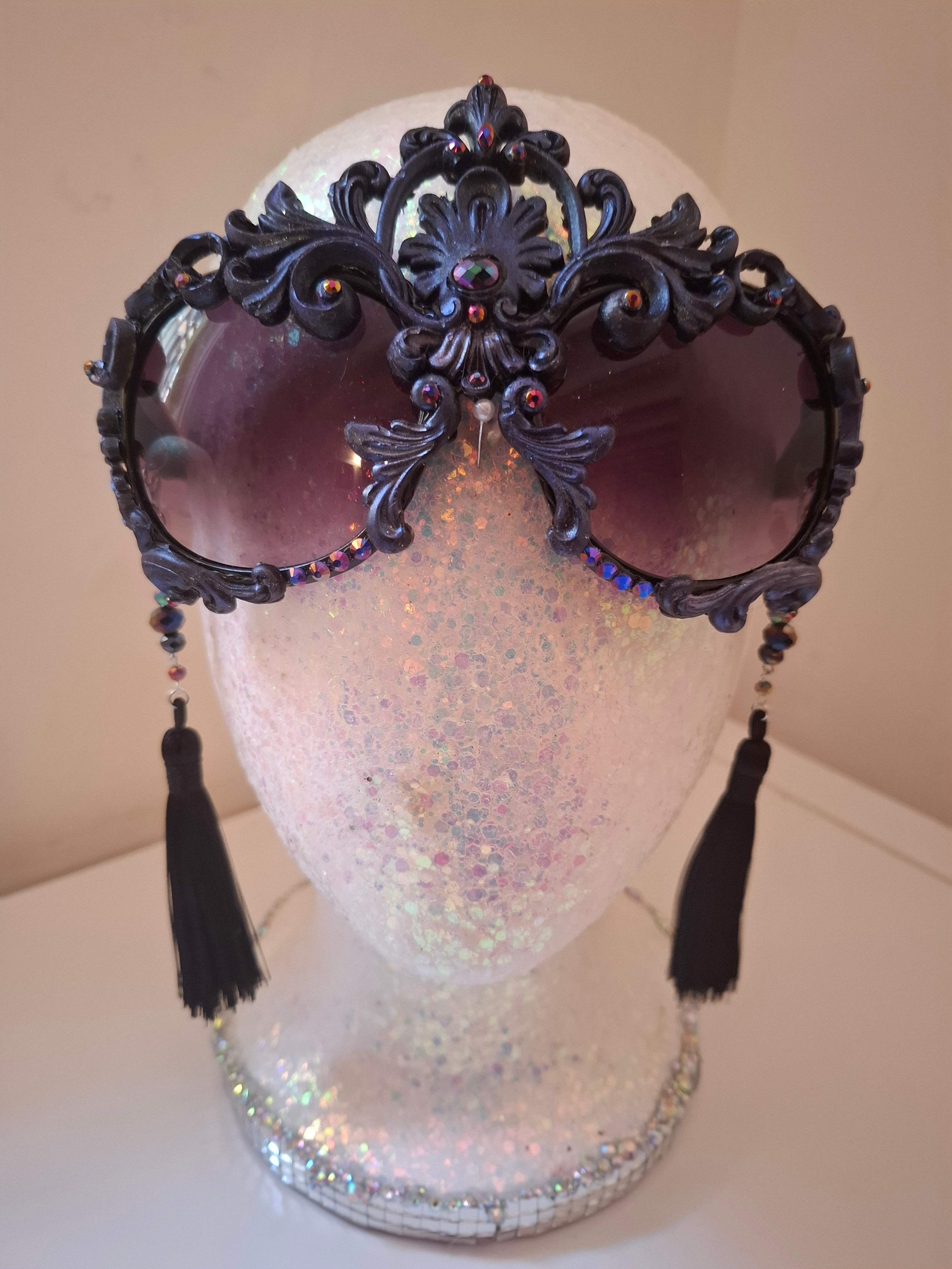Hand-sculpted sunglasses in midnight indigo with iridescent detail. 