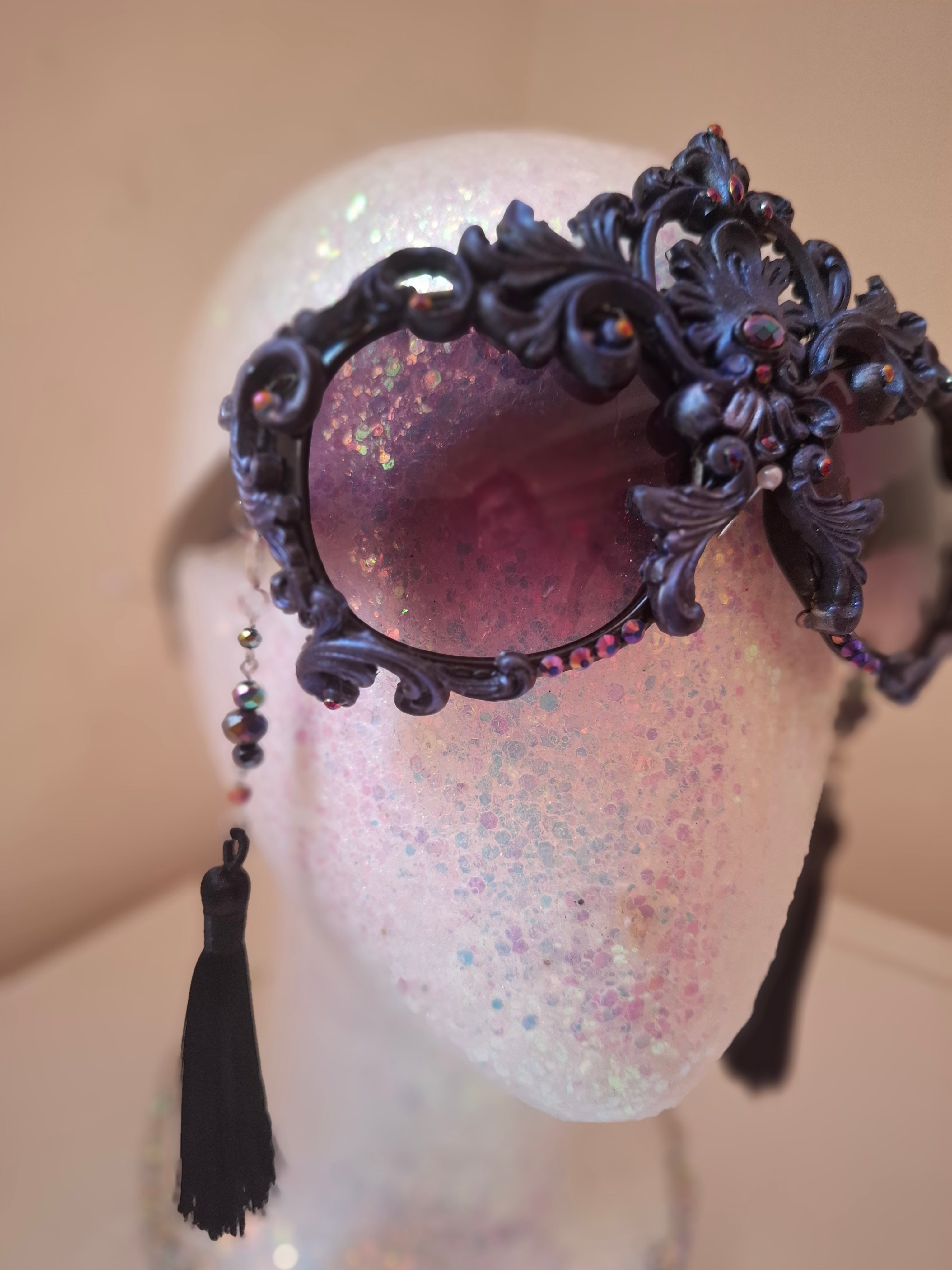 Hand-sculpted sunglasses in midnight indigo with iridescent detail. 