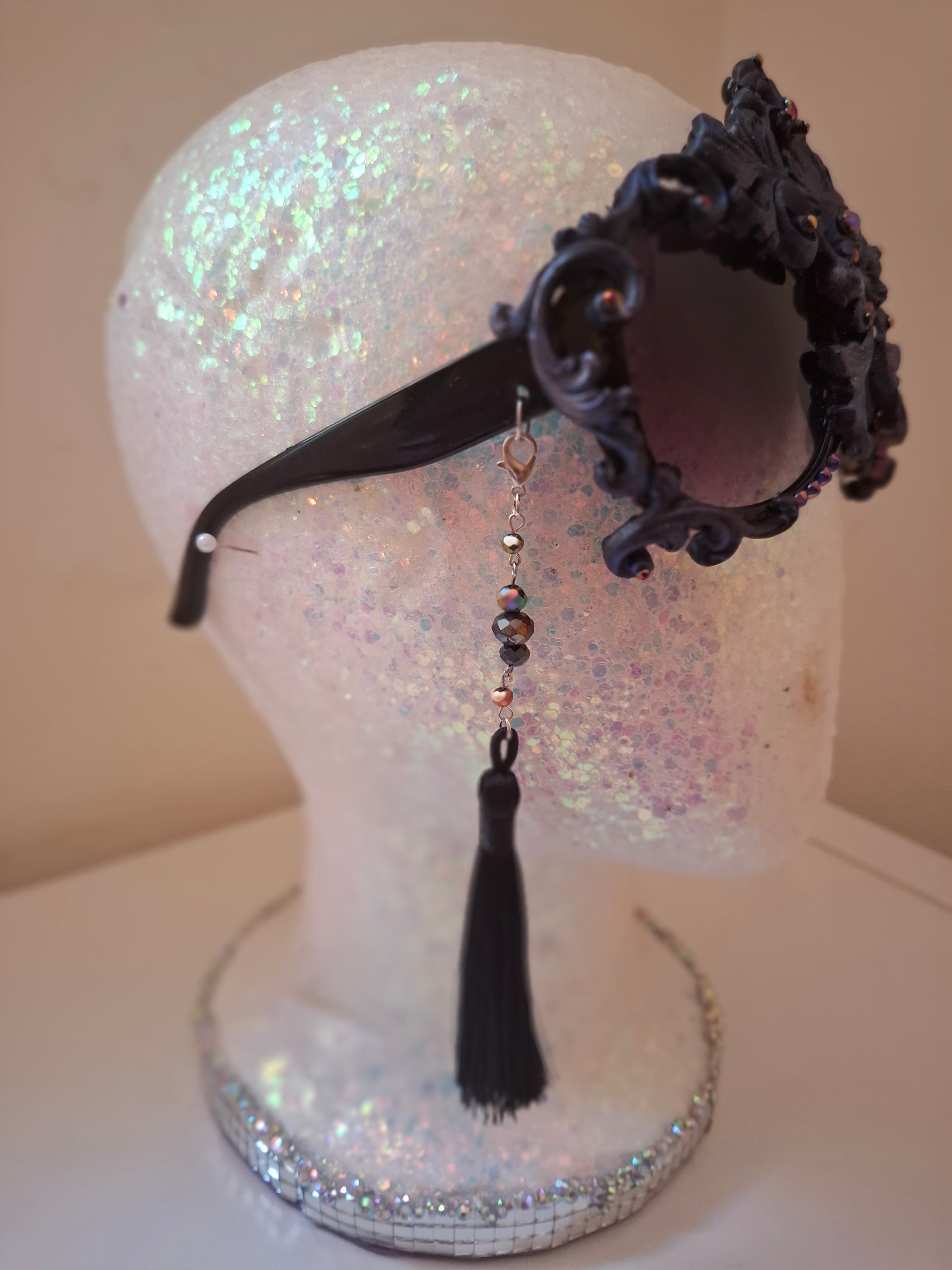 Hand-sculpted sunglasses in midnight indigo with iridescent detail. 