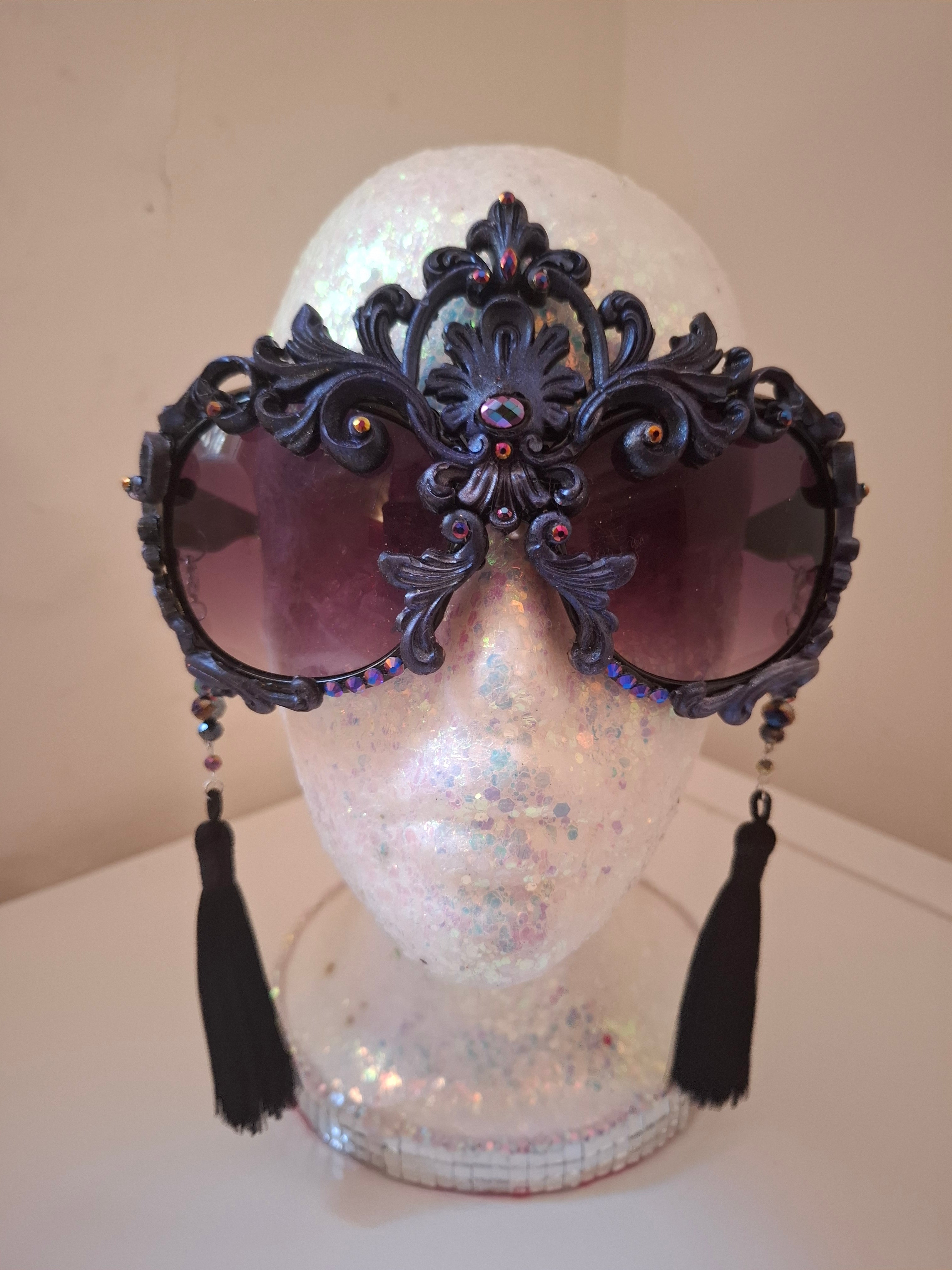 Hand-sculpted sunglasses in midnight indigo with iridescent detail. 