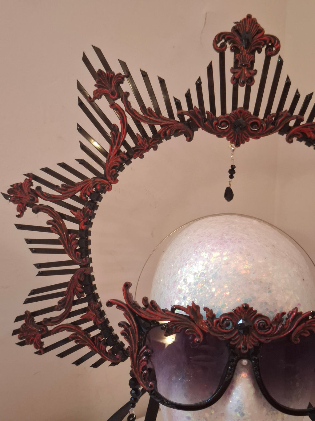 Hand-sculpted crown headpiece in crimson scrollwork, matching the Ethel sunglasses
