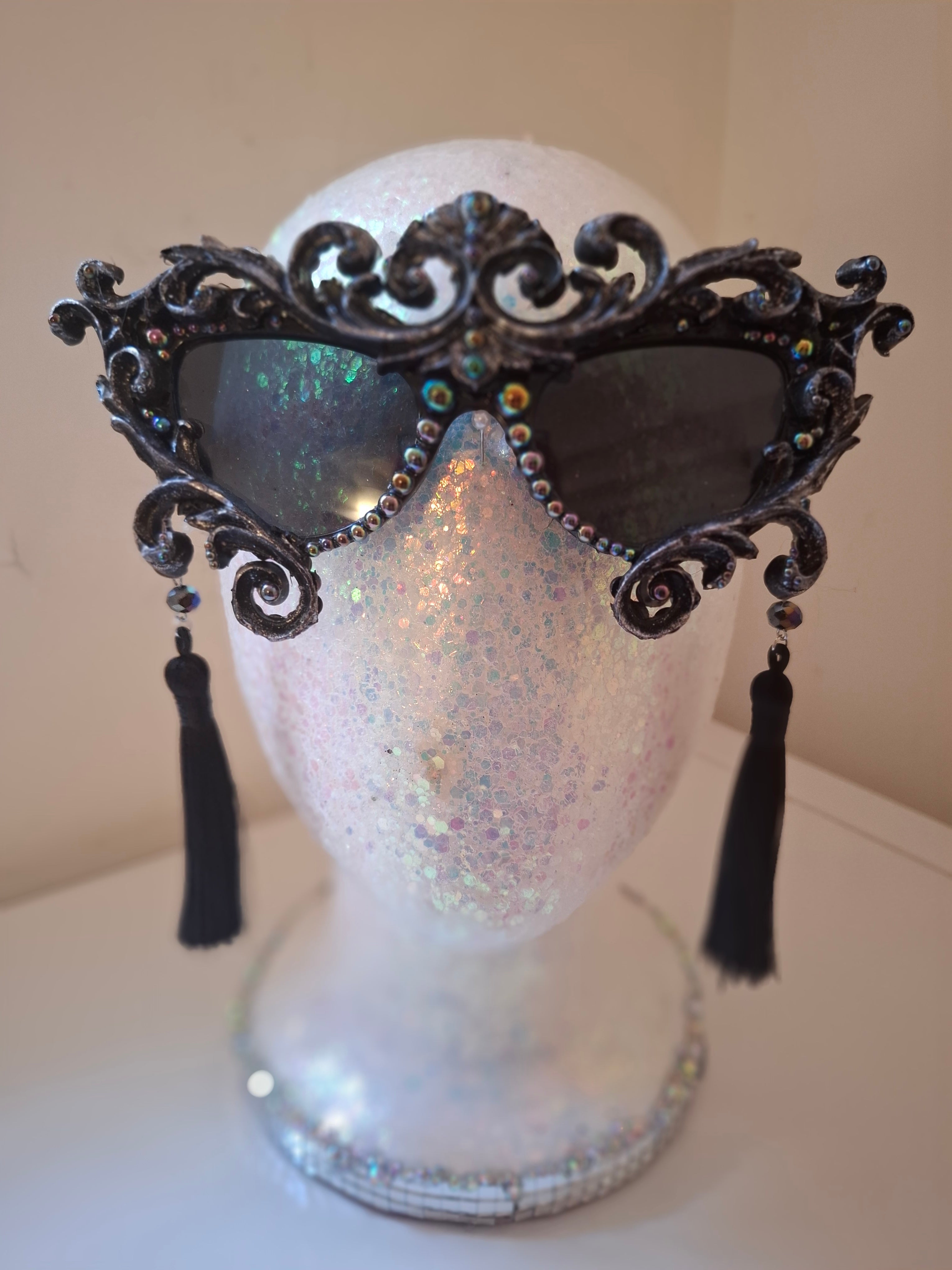 Hand-sculpted sunglasses with oil-slick pearl and silver bone detail