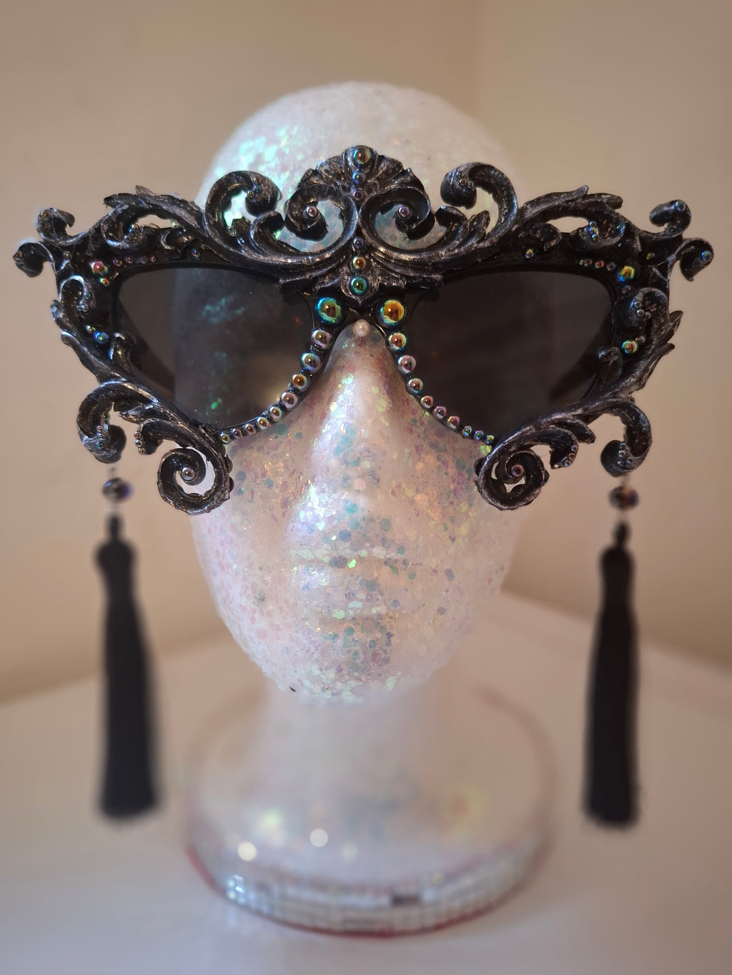Hand-sculpted sunglasses with oil-slick pearl and silver bone detail