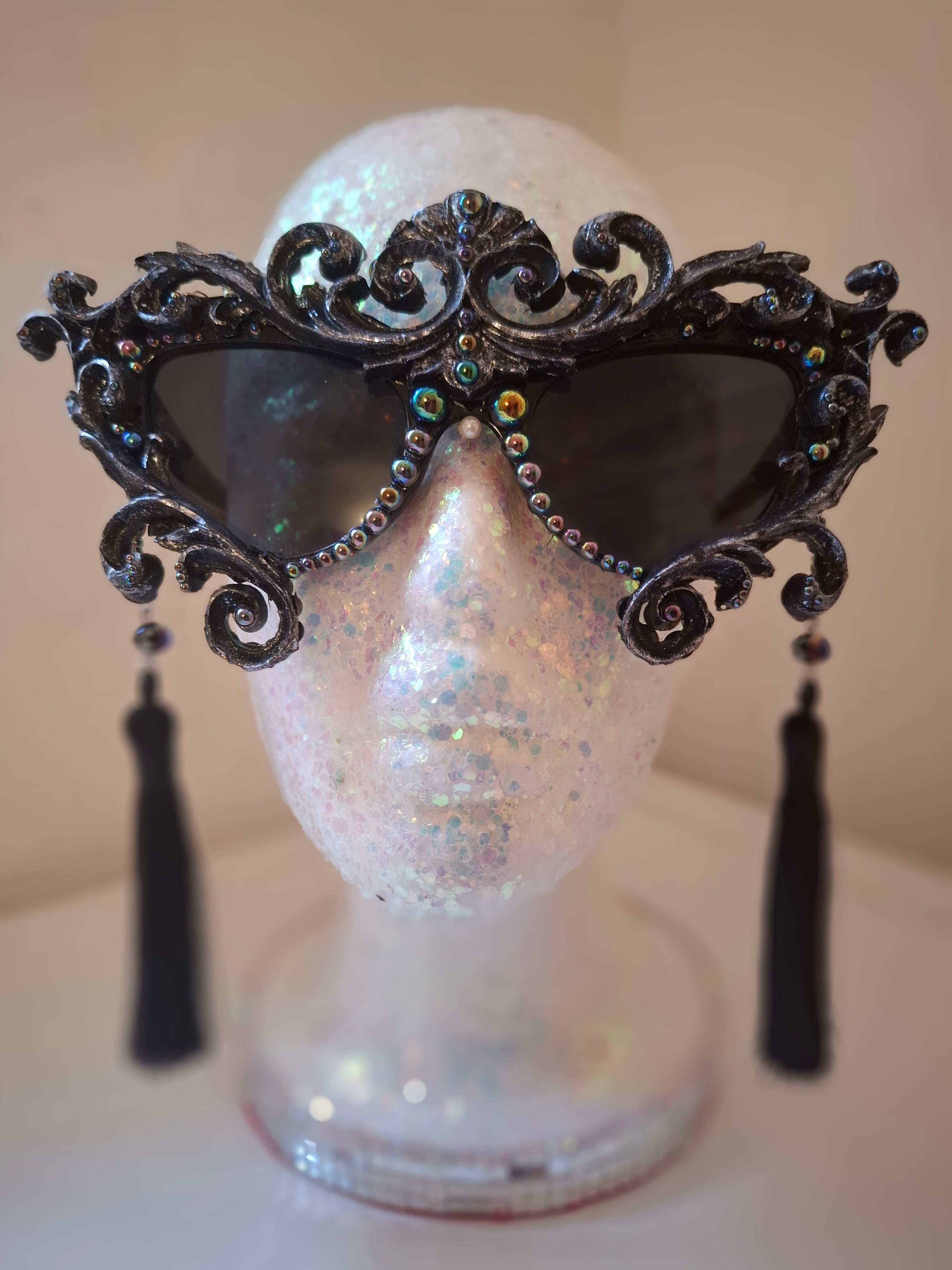 Hand-sculpted sunglasses with oil-slick pearl and silver bone detail