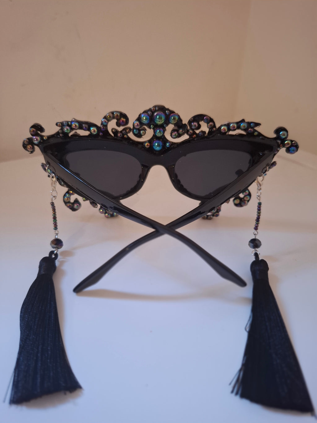 Hand-sculpted sunglasses with oil-slick pearl and silver bone detail