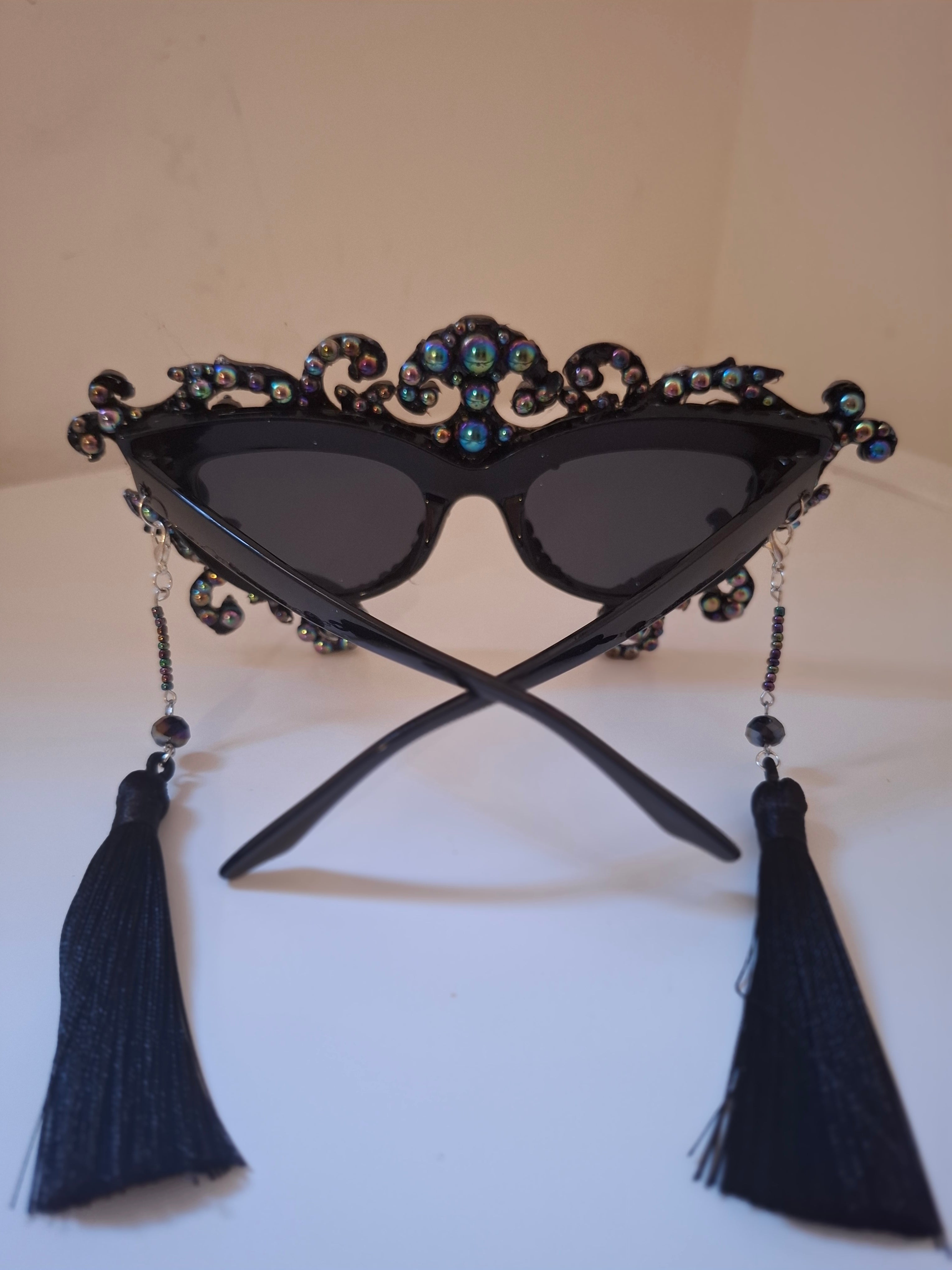 Hand-sculpted sunglasses with oil-slick pearl and silver bone detail