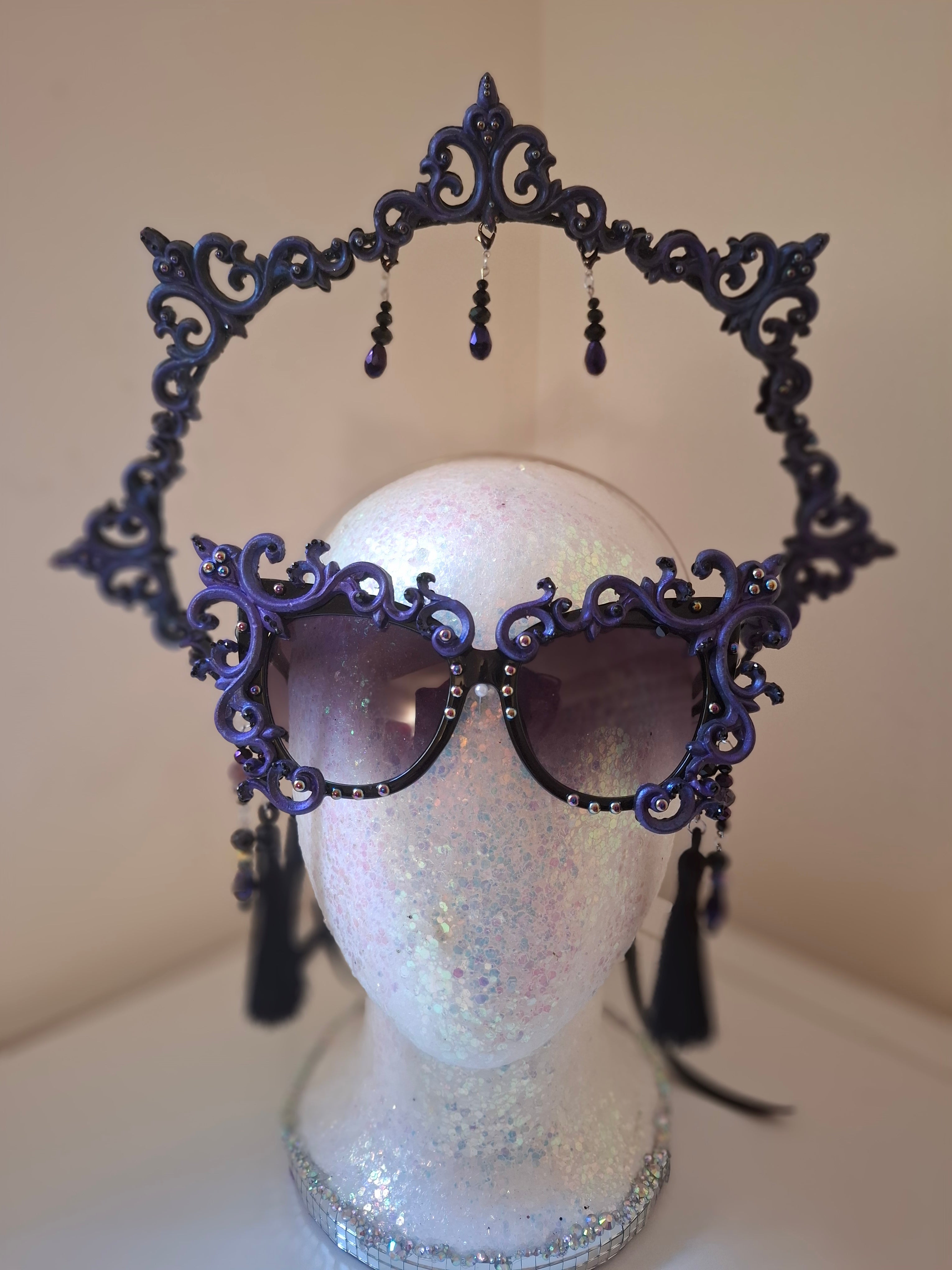 Hand-sculpted sunglasses with smoke-swirl scrollwork detail