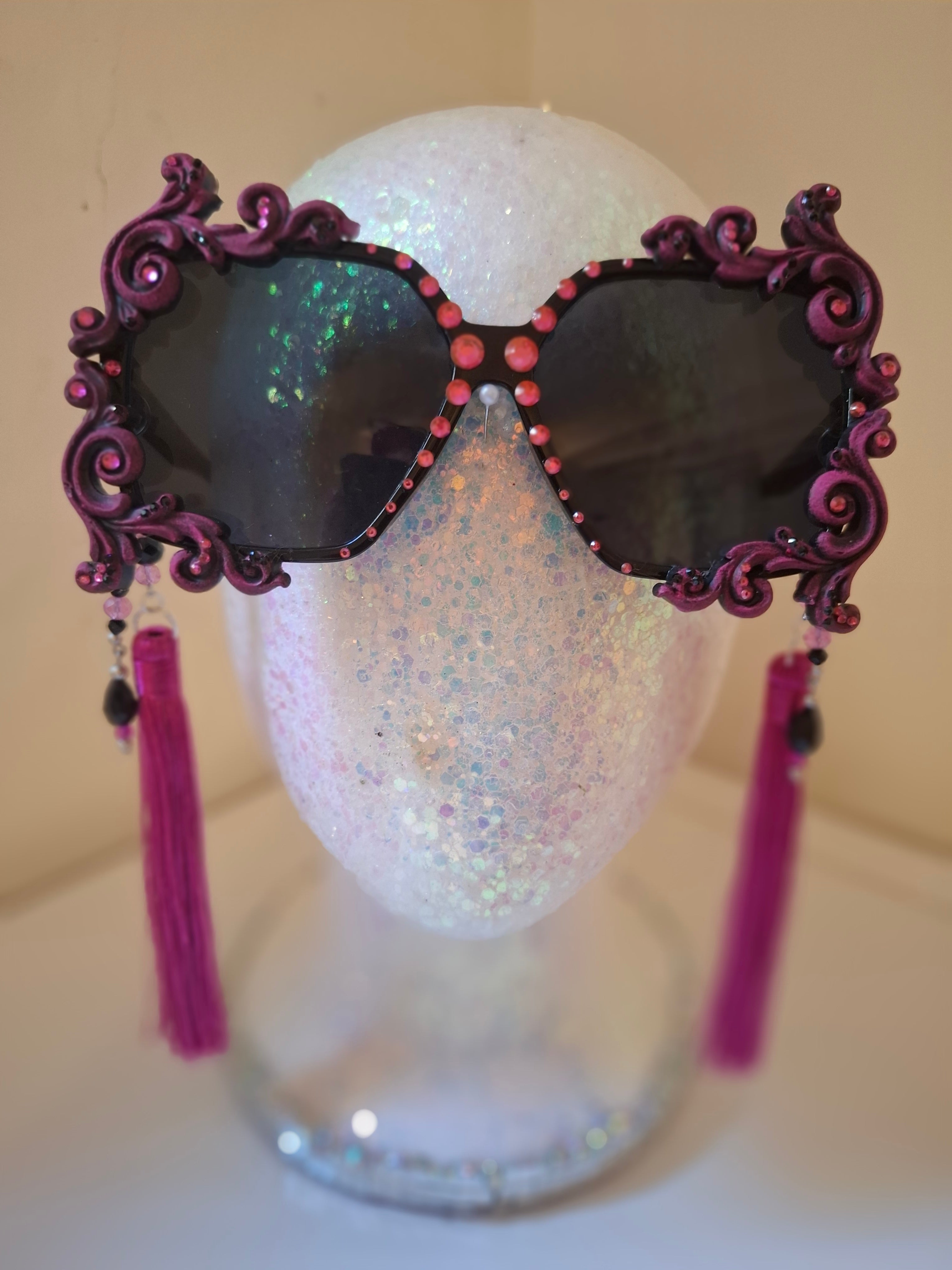 Hand-sculpted sunglasses in hot pink scrollwork