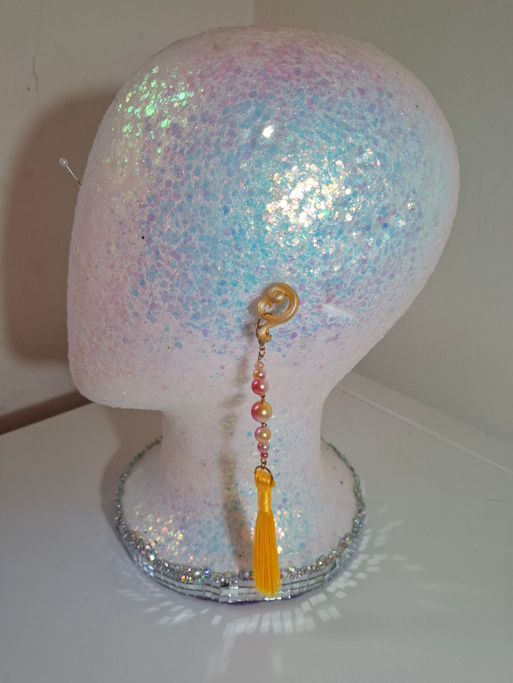 Hand-sculpted resin earrings with beading and tassels, matching the Aurelys sunglasses.