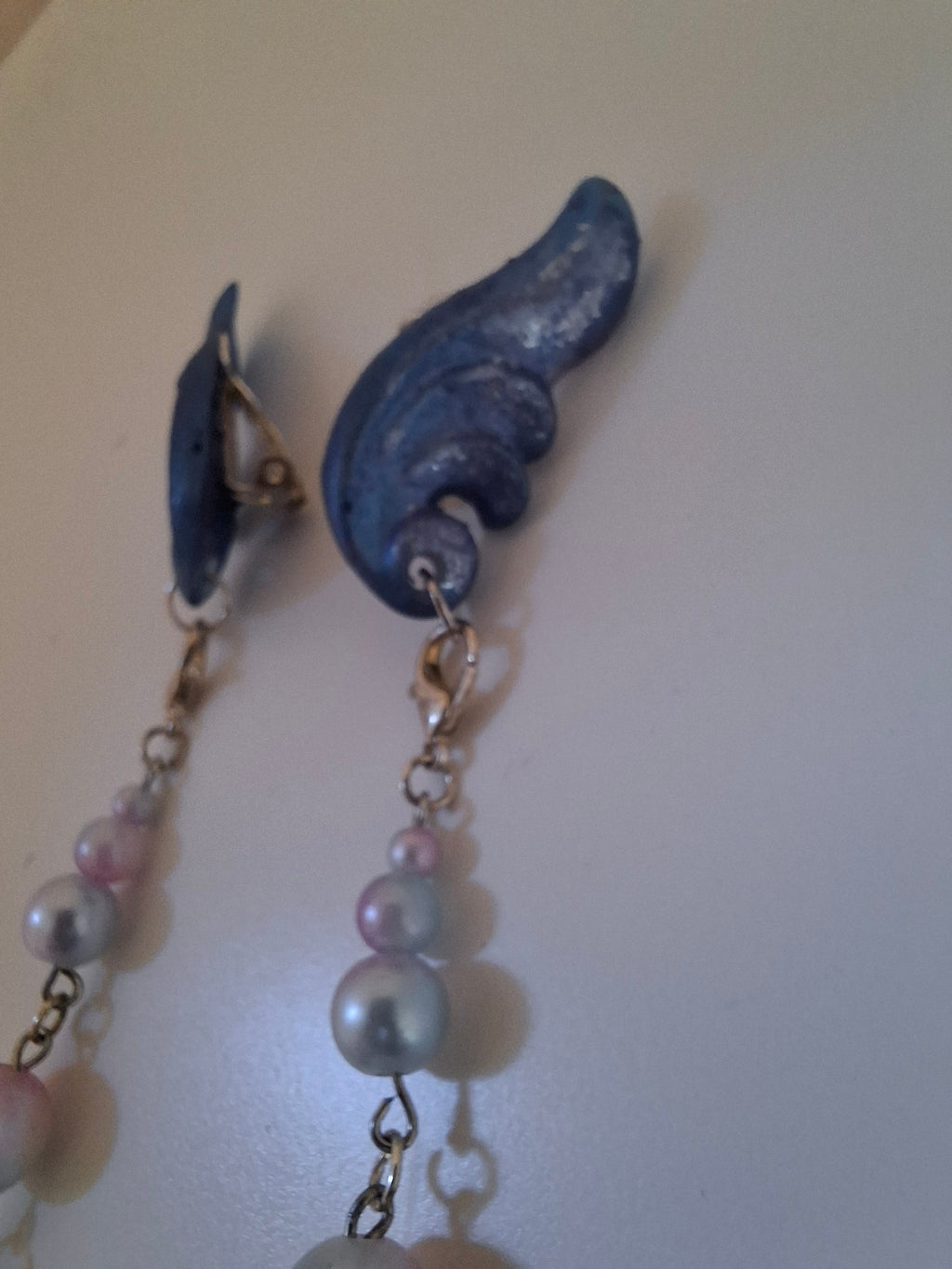 Hand-sculpted resin earrings with beading and tassels