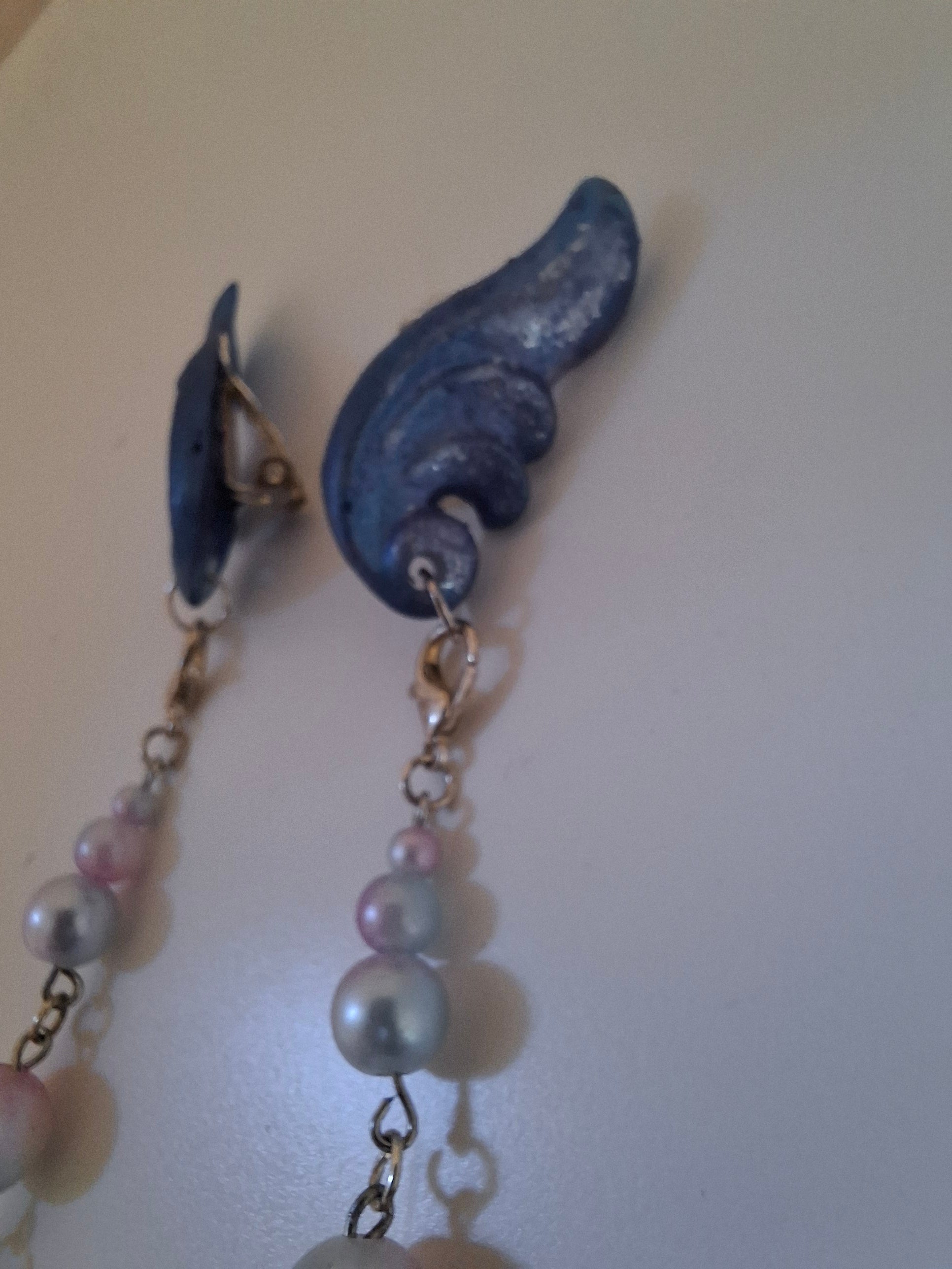 Hand-sculpted resin earrings with beading and tassels