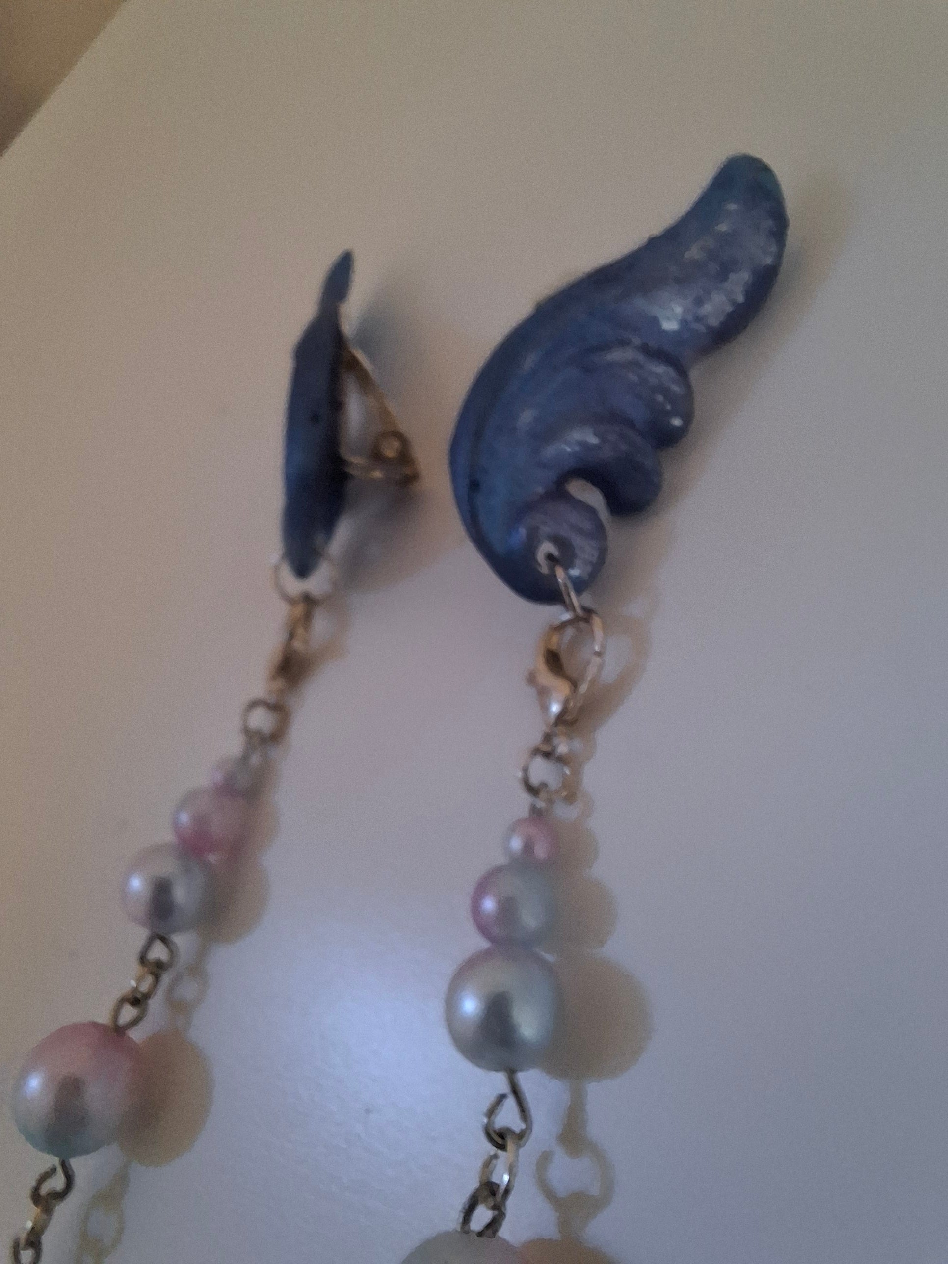 Hand-sculpted resin earrings with beading and tassels