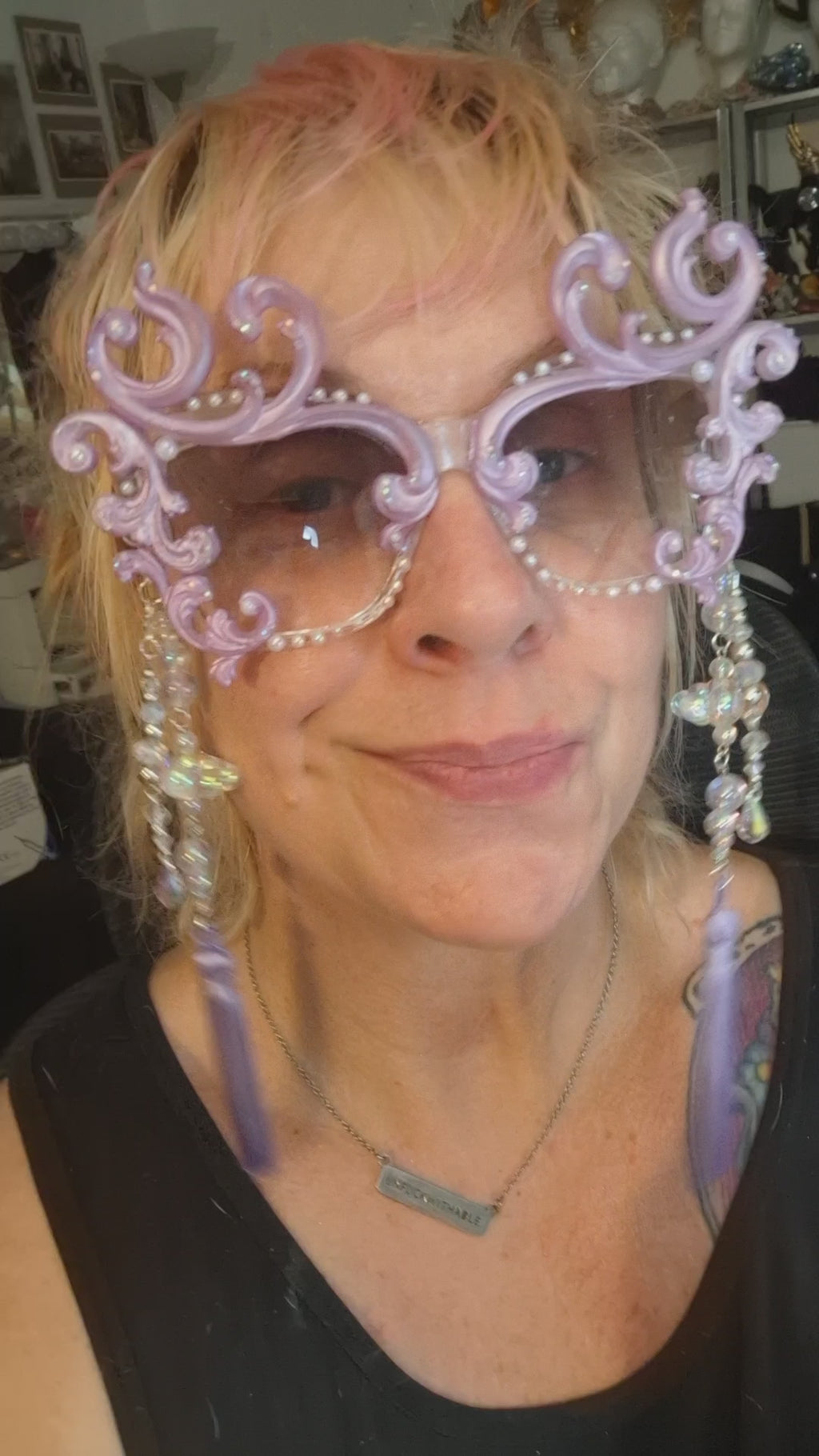 Hand-sculpted sunglasses in soft lavender scrollwork with opalescent pearls and lilac tassels.
