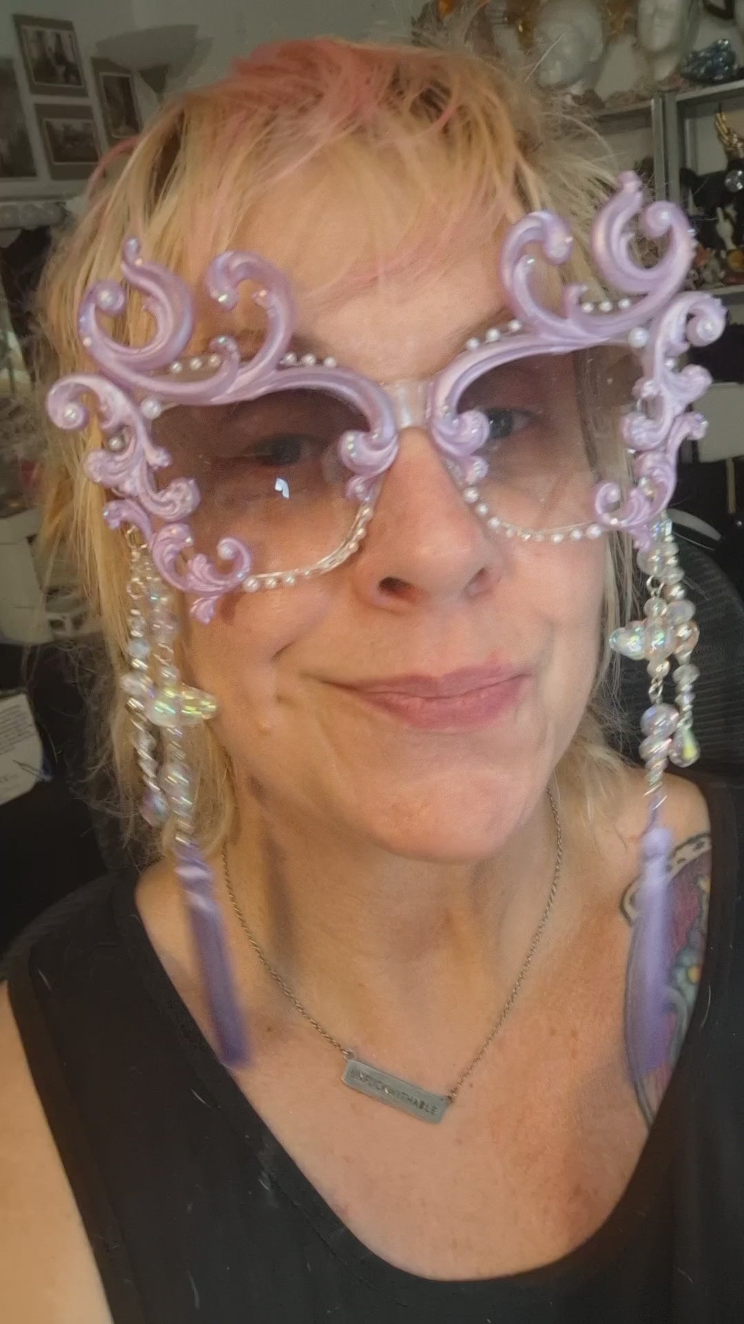Hand-sculpted sunglasses in soft lavender scrollwork with opalescent pearls and lilac tassels.